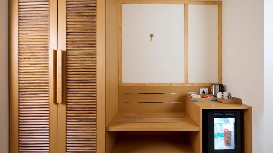 a wardrobe and minibar in the Deluxe room at ABN Sarovar Portico, Jim Corbett