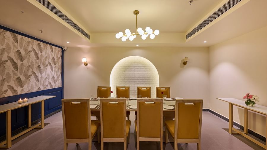 table for eight in the private dining room of Flavours all day dining at ABN Sarovar Portico, Jim Corbett