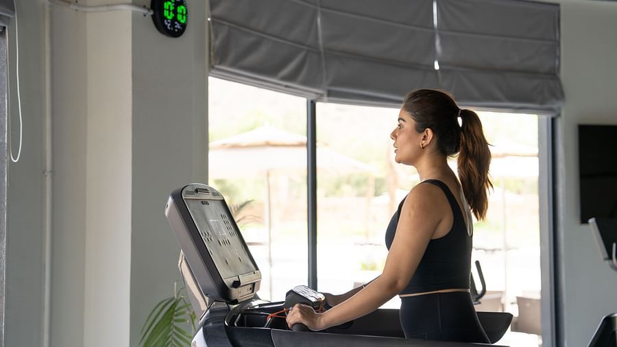 A Woman working out in a gym at Ananta Spa and Resort, Ajabgarh 