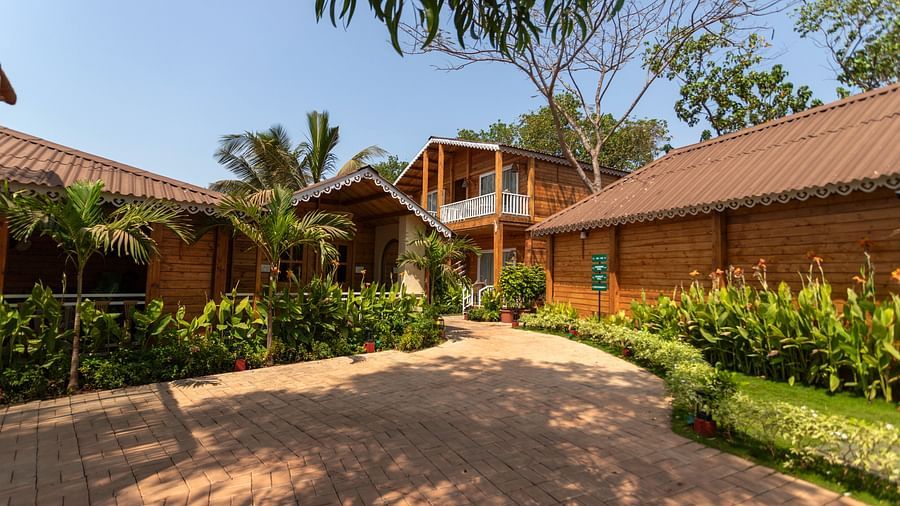 a path surrounded by villas and greenery at Aralea Beach Resort by Stone Wood, Morjim