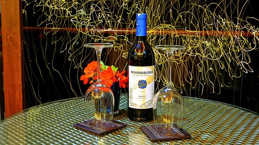 liquor bottle with glasses on table - Aranya Himalayan Retreat, Mashobra