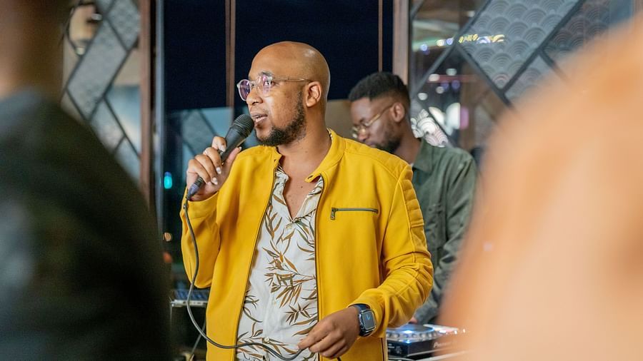 A man talking on the mic at Asiatic Lounge in Kenya