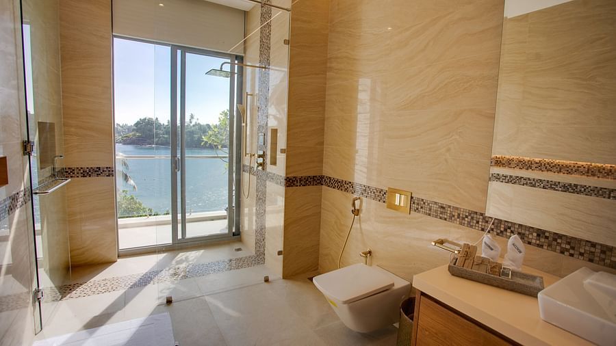 image of the well-appointed bathroom at the sea view superior suite featuring a french window