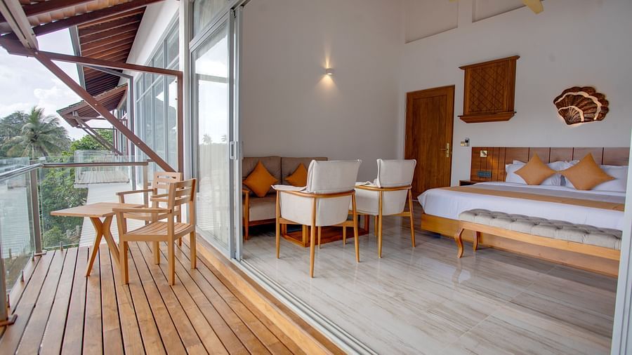 image of the sea view suite with a king size bed overseeing an opulent and spacious balcony with an amazing view