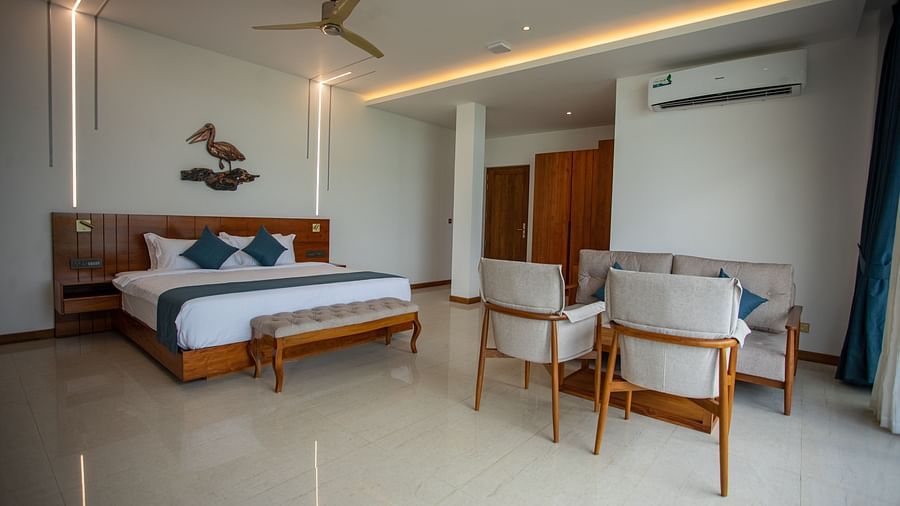 mage of the sea view suite featuring a pelican mural above the king size bed 