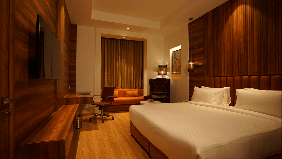 cosy room with king size bed and wooden furnishings