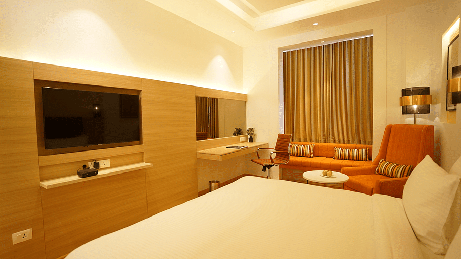 cosy room with king size bed and wooden furnishings