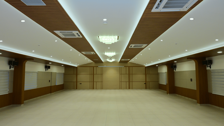 Banquet hall of Bhavanis Vista By Icon featuring an empty floor and ceiling lighting.