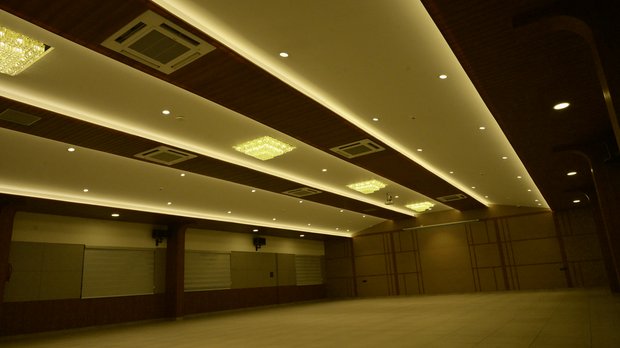Banquet hall of Bhavanis Vista By Icon featuring an empty floor and ventilation fixtures.