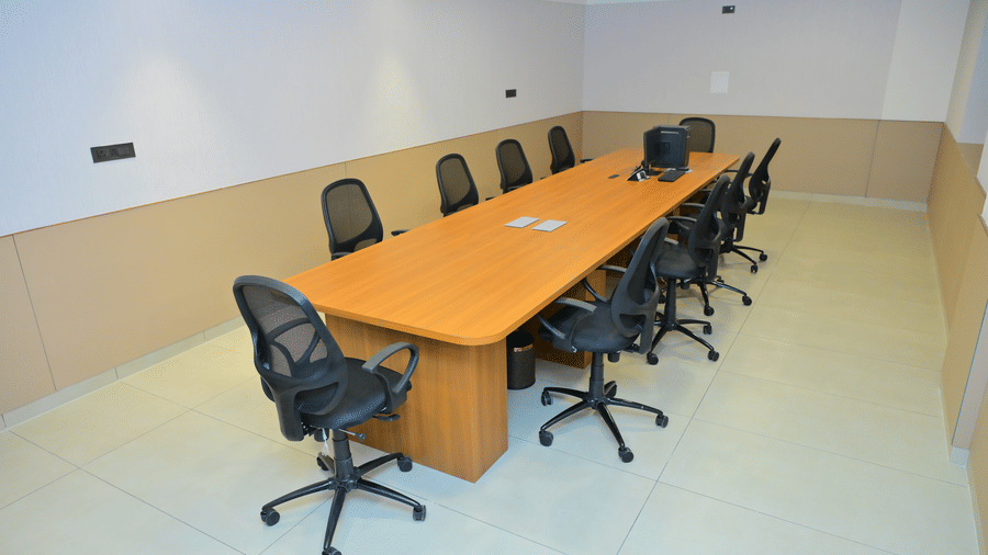 Conference room of Bhavanis Vista By Icon featuring a table and chairs.