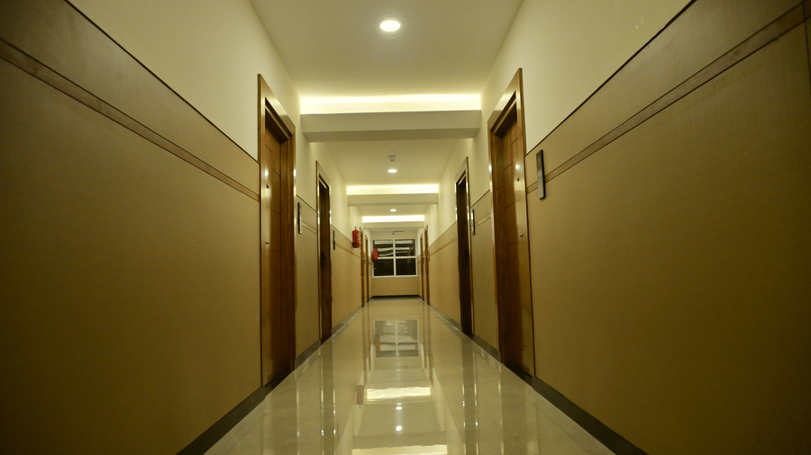 Corridor of Bhavanis Vista By Icon featuring doors and flooring.