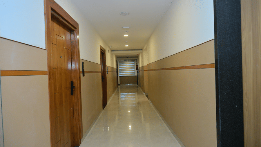 Corridor of Bhavanis Vista By Icon featuring doors and flooring.