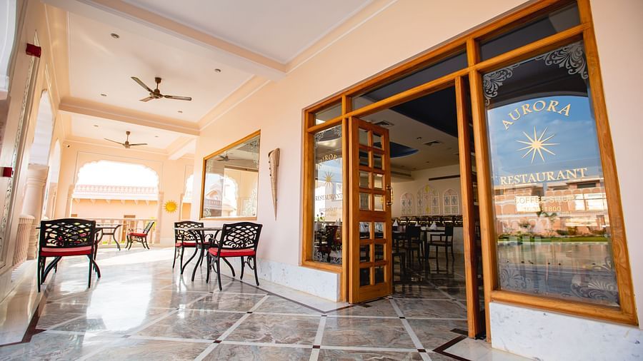 Buena Vista Luxury Garden Spa Resort - the outside seating space of Aurora, a restaurant in Jaipur