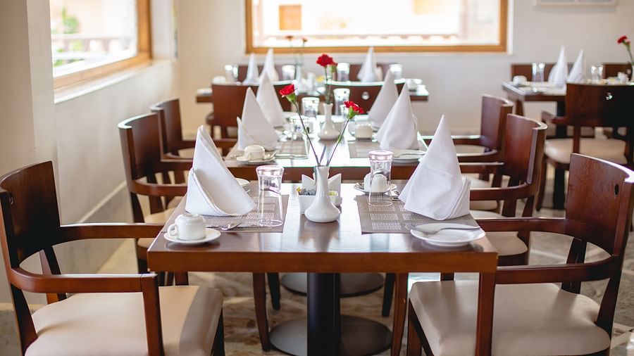 Buena Vista Luxury Garden Spa Resort - a close-up of seats at an indoor seating arrangement at Aurora, a restaurant in Jaipur