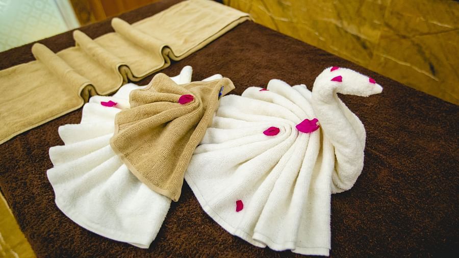 Buena Vista Luxury Garden Spa Resort - a spa bed with towels decorated on top of it