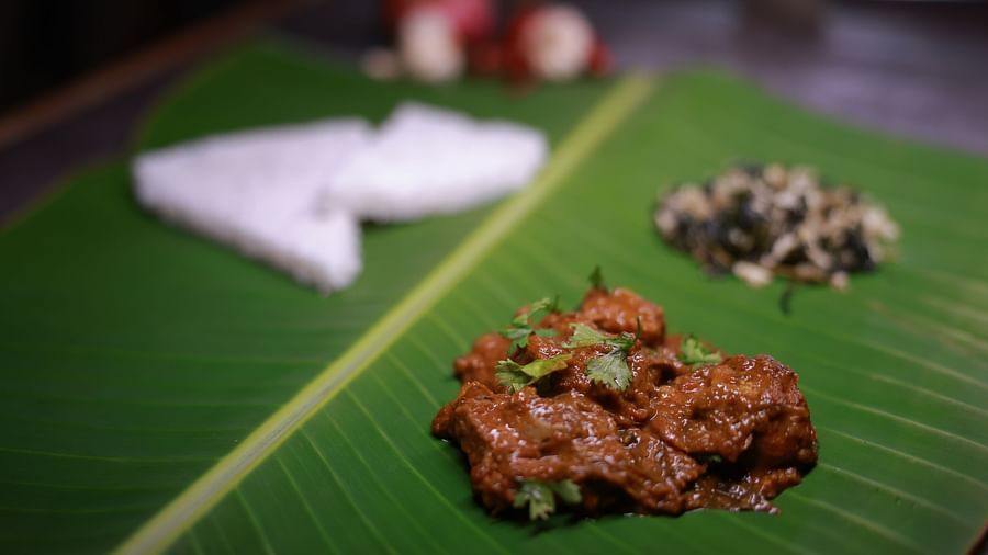 A south Indian dish with sides on a banana leaf at The canopy, Capitol Village Resort, Madikeri