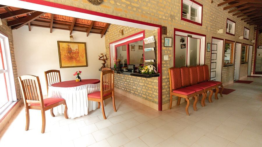Seating arrangements in the lobby at Capitol Village Resort Madikeri