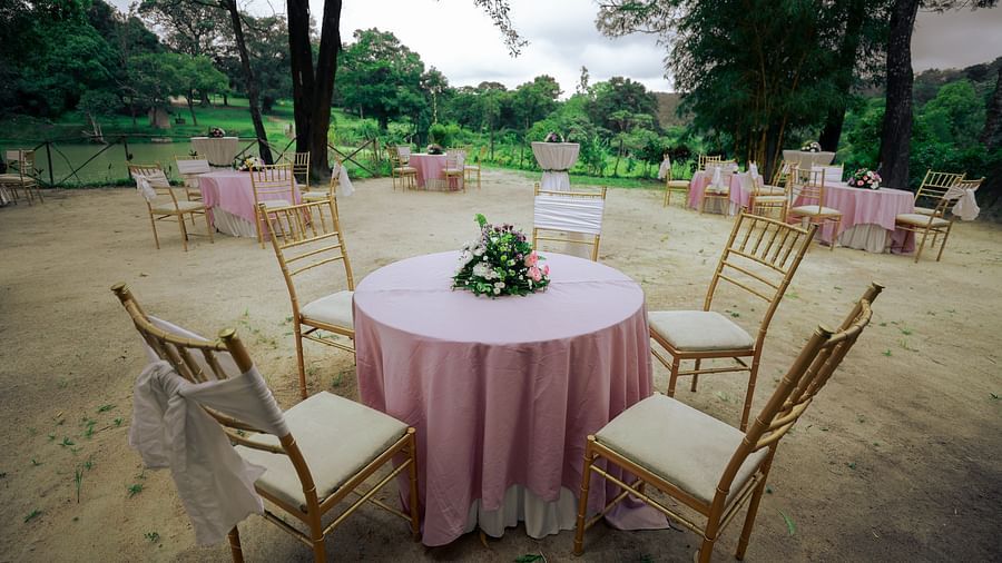 Seating arrangmenets in an open air setting at The Carp, Capitol Village Resort, Madikeri