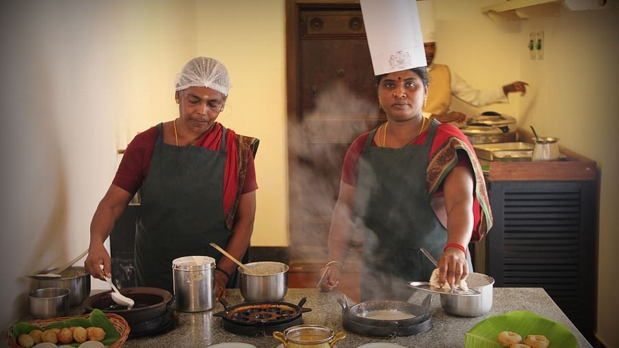 Two cooks conducting a cooking workshop at Chidambara Vilas