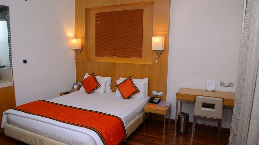 Superior Room with bed work desk and large windows - Citrus Classic Bengaluru