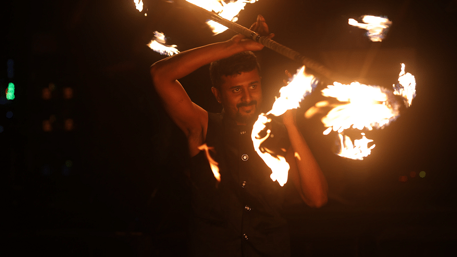 A man performing a fire display at Nysa Skybar, Bengaluru.