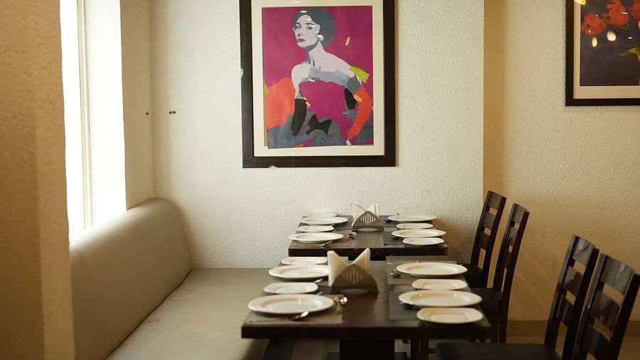 Dining area with a table and chairs for seating at Clarks Collection, Bhavnagar