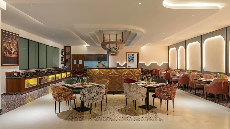 Elegant restaurant with plush seating and warm lighting.