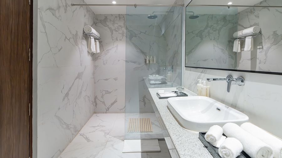 Stylish bathroom with a modern vanity and large mirror.