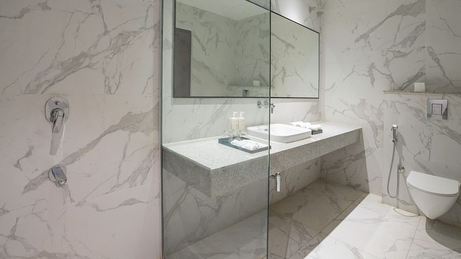 Stylish bathroom with a modern vanity and large mirror.