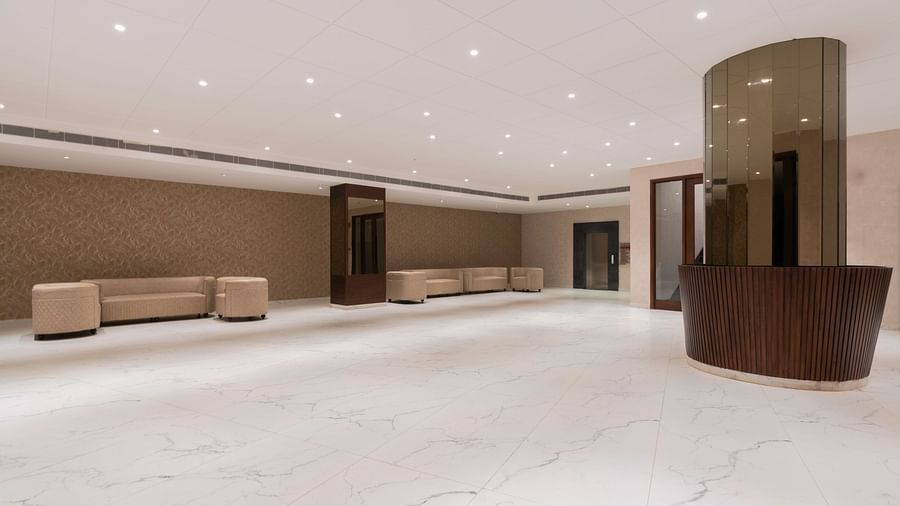 Spacious  area with high ceilings and modern decor.