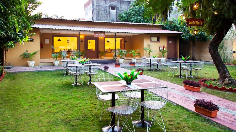 Restaurant with bright lights and arranged table and white chairs