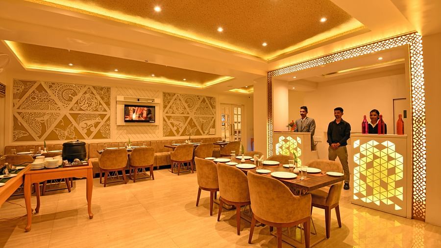 Seating arragements with the staff behind the counter at the Bridge - Clarks Residences Nainital