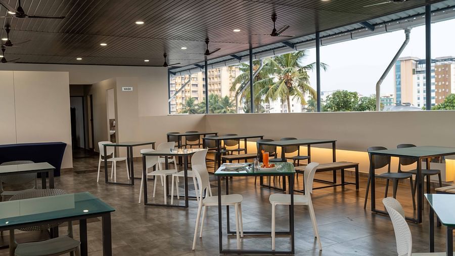 Our restaurant with comfortable chairs and tables - Court 11, Kochi