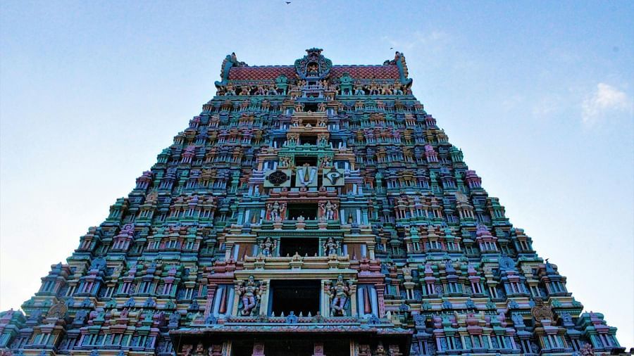 An image of south indian style temple with multiple storeys where idols are made