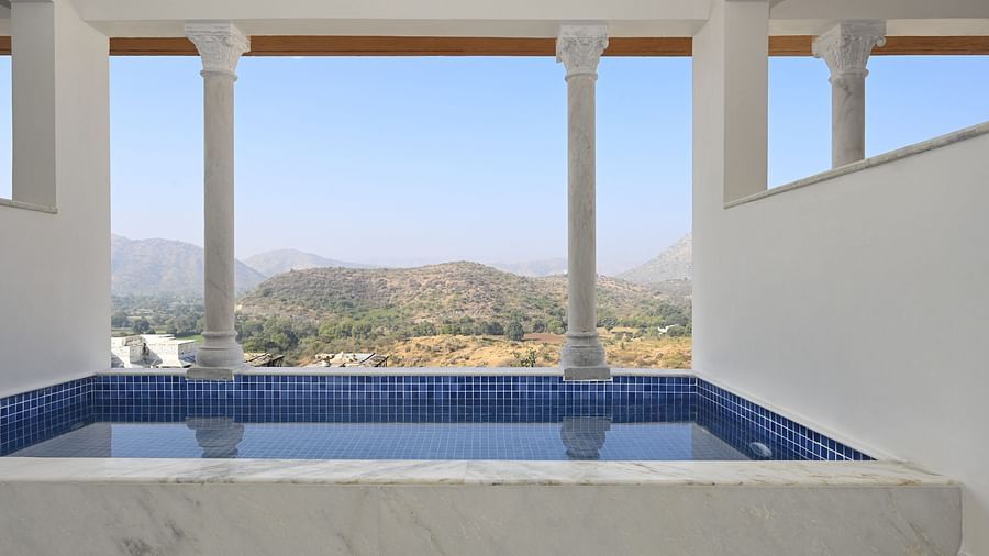 Fateh Vilas Udaipur - Image of a plunge pool overlooking a hill range