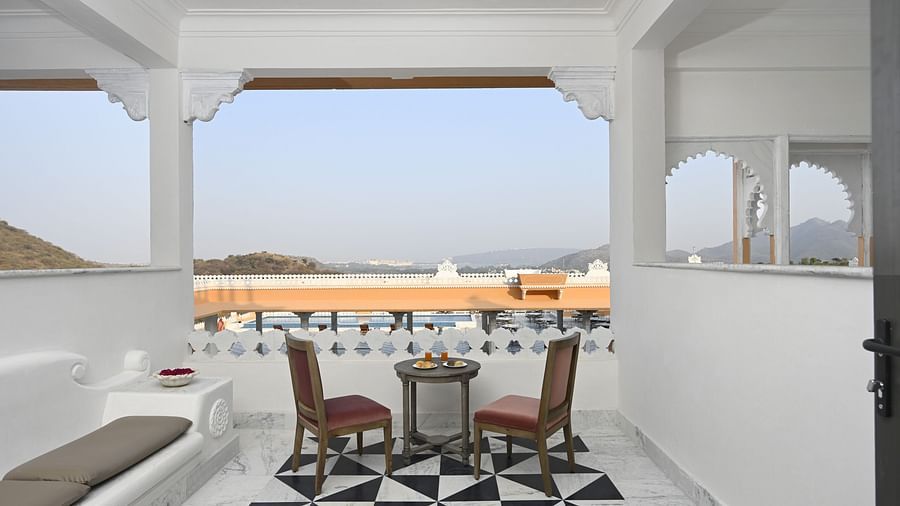 Fateh Vilas Udaipur - view of the balcony featuring seating options and a white marble floor
