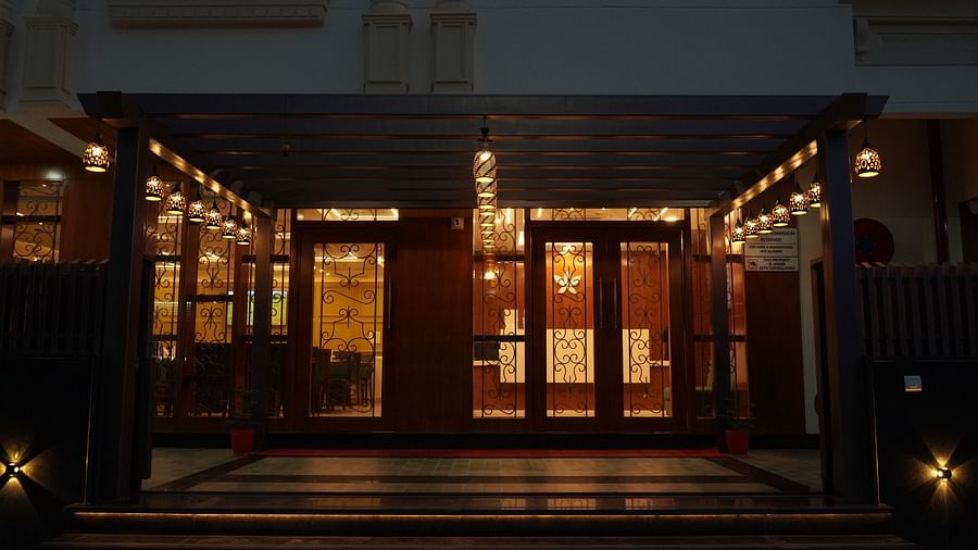 An image of an entrance to Five Elements Hotel, Jodhpur which is well lit and also giving a sneak peak of the dining area