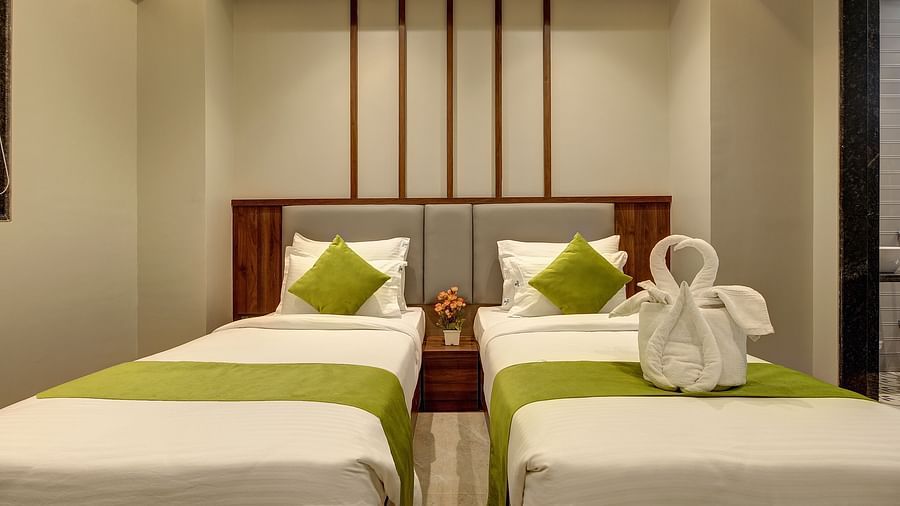 Close up shot of the twin beds inside Premium Twin Sharing Room - Fortune House, Magarpatta
