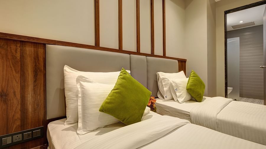 A close up shot of the twin beds inside Premium Twin Sharing Room - Fortune House, Magarpatta