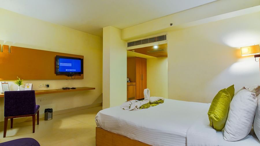 a view of Super Premium room furnished with a bed and a tv at GIS Select
