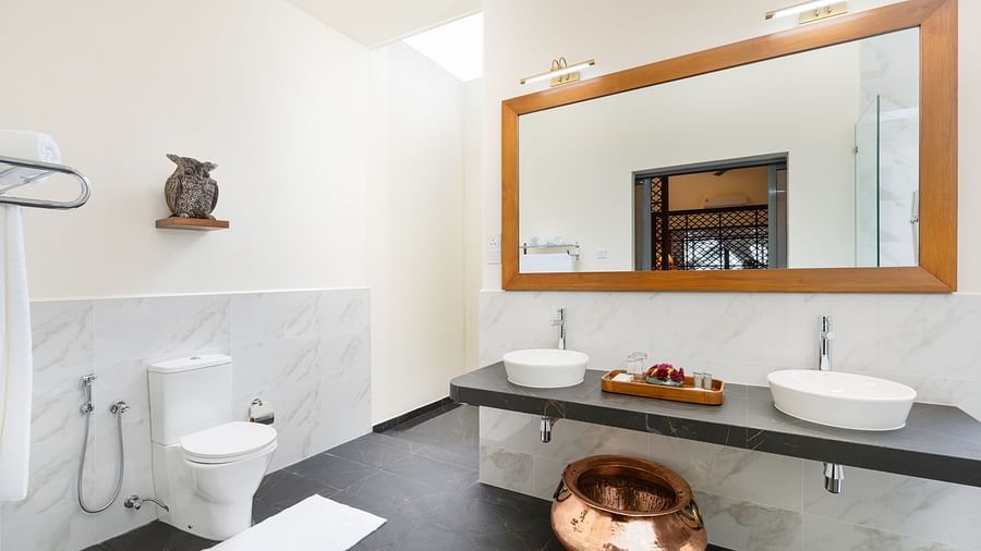 A spacious bathroom with sleek fixtures, a large mirror, and modern finishes for a sophisticated look - Heavensa Villas and Suites by the Clarks, Galle