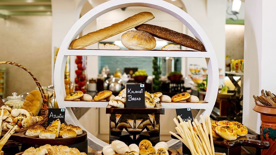 an assortment of dishes and desserts at chutney - restaurant near arossim beach in goa at Heritage Village Resorts and spa