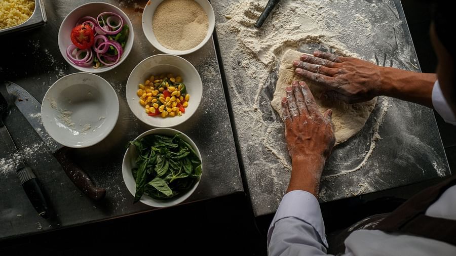 chef making a pizza from scratch