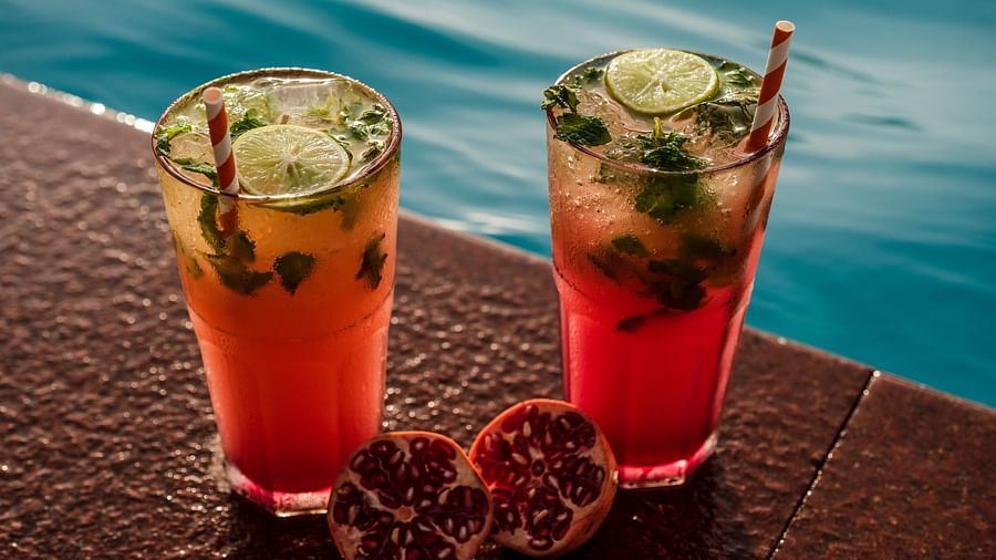 two pomegranate drinks by the pool