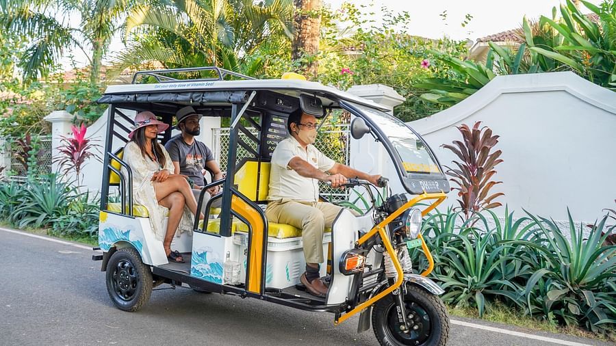guests in a battery e-rickshaw