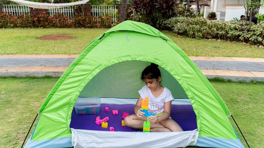 a girl playing in a tent