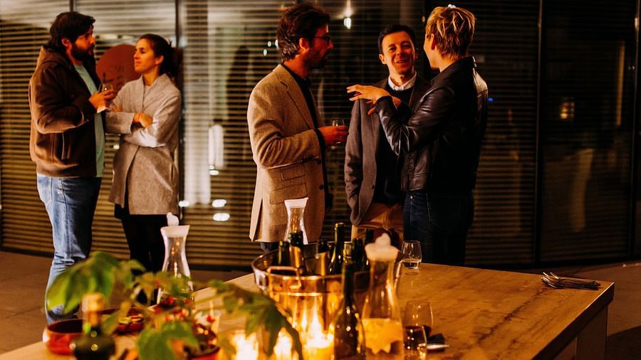 people talking in a dimly lit room