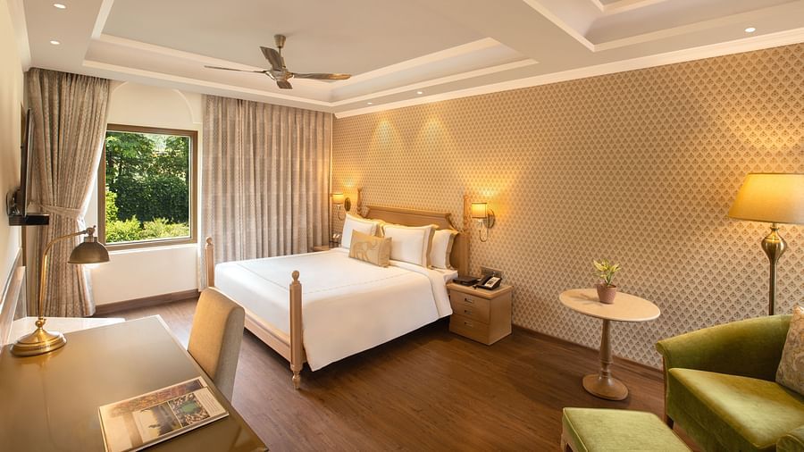 suite in manesar with a comfy king size bed, lavish interiors and wooden flooring