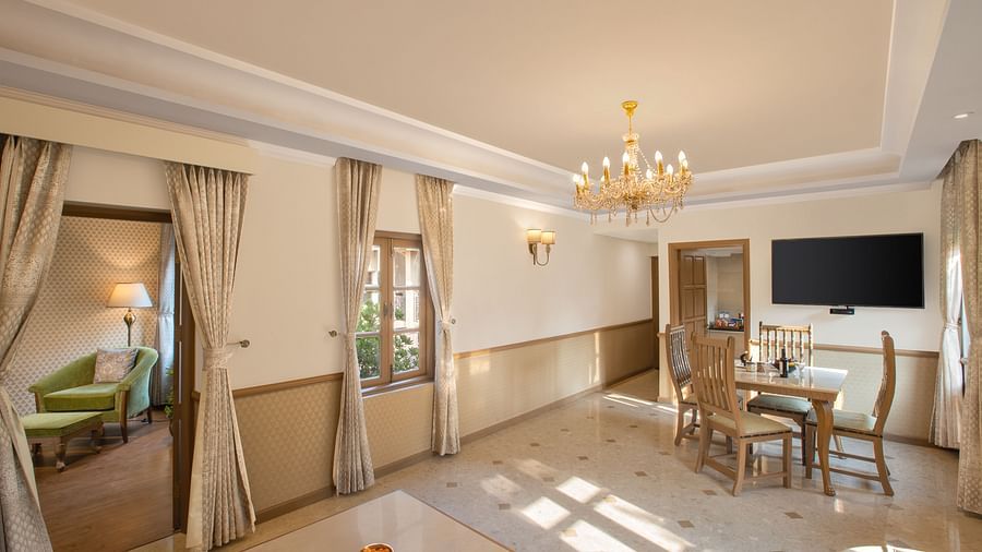 heritage suite with a lavish separate living area and dining table