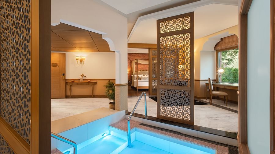 luxurious room with swimming pool in manesar at heritage village resort and spa